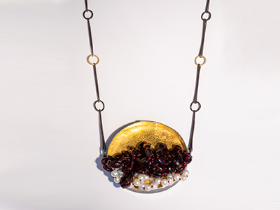 Ornately beaded gold and red necklace by jo mcallister
