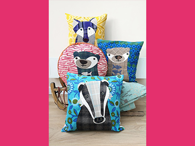 Patchwork appliqued animals on colourful pillow