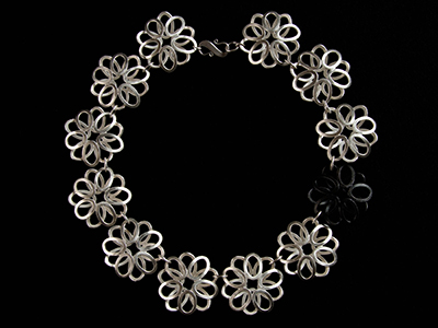 Image of a hand crafted bracelet made from metal flowers