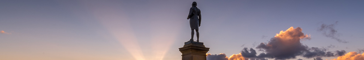 Captain Cook statue against a clear indigo coloured sky
