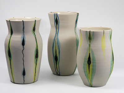 White vases with colourful patterns