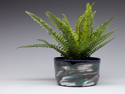 Plant pot covered in blue and white brushtrokes