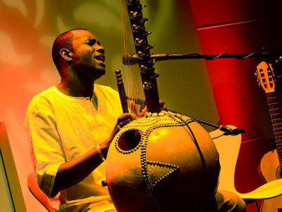 A picture of Sura Susso playing music